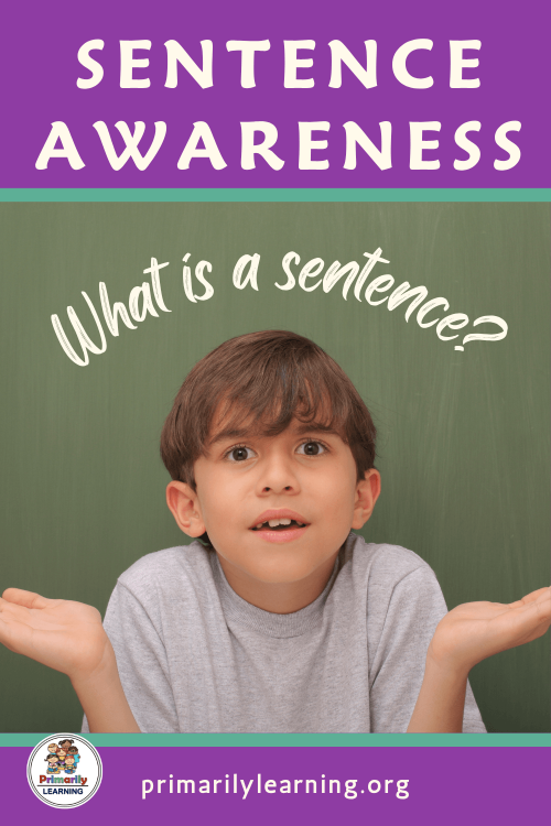 Young boy confused with sentence awareness activity on chalkboard.